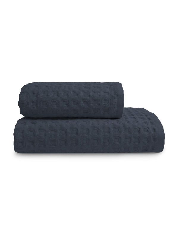 Serviette éponge marine 50x100 cm en coton 100% avec finition liteau renforcée