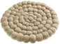 Dessous de plat Brian Naturel en boules de laine tressées, motif circulaire