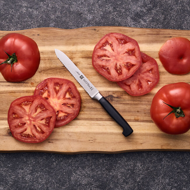 Couteau universel 13 cm, tranchant dentelé Four Star - Zwilling