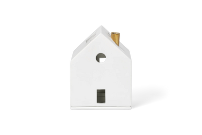 Maison lumineuse cheminée dorée Räder porcelaine blanche