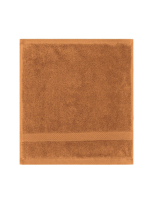Carré de bain Elea 50x50 cm en coton orange rouille, éponge douce et absorbante