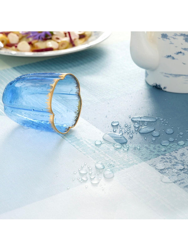 Nappe enduite Mille Textures bleu en coton, finition ourlets, format 175 cm