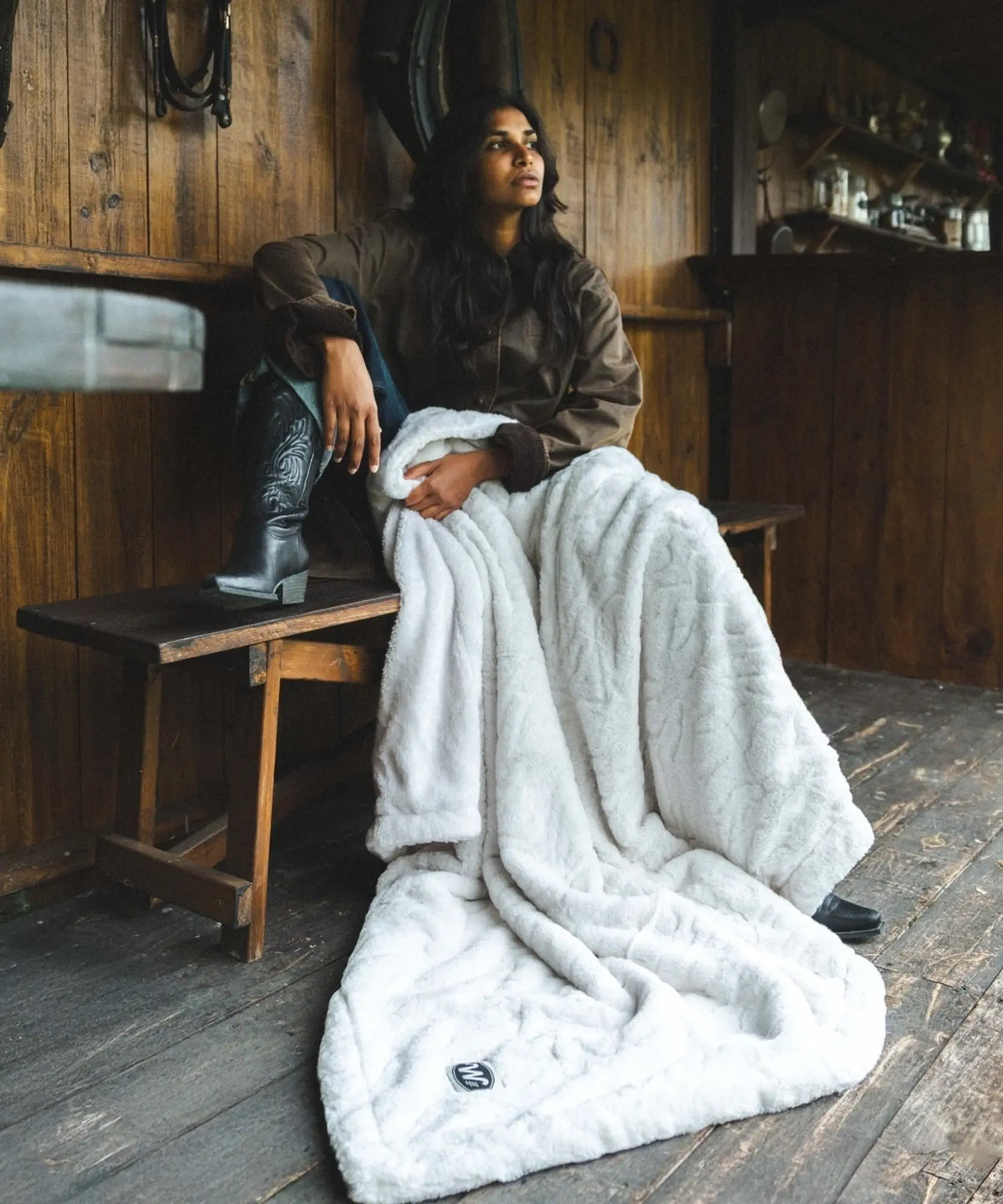 Plaid Ours Polaire Blanc sur les genoux