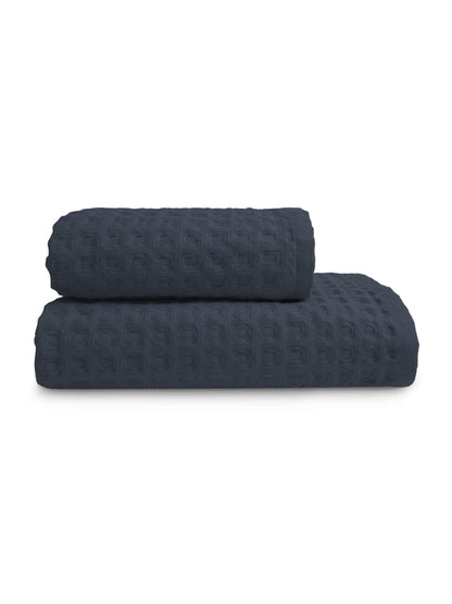 Serviette éponge marine 50x100 cm en coton 100% avec finition liteau renforcée