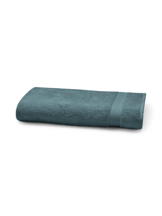 Serviette éponge Elea coloris pétrole 50x100 cm en coton zéro twist, moelleuse et absorbante