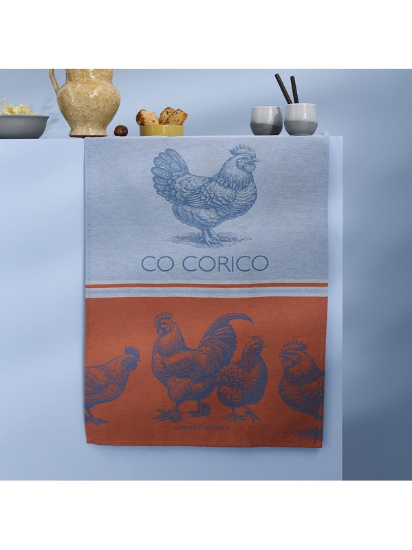 Torchon Coq Corico Tango bleu 56x77 cm en coton avec motif graphique
