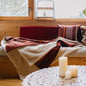 Plaid biface Artiga Sarron - rayures colorées sur fond rouge profond