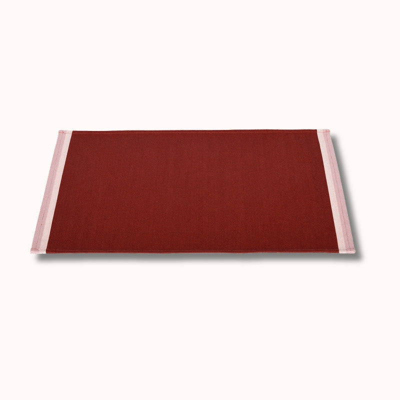 Set de table enduit Artiga Sarron - rayures colorées sur fond rouge profond